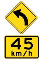 road sign ndicating driver should do 45 km/h when going around a bend